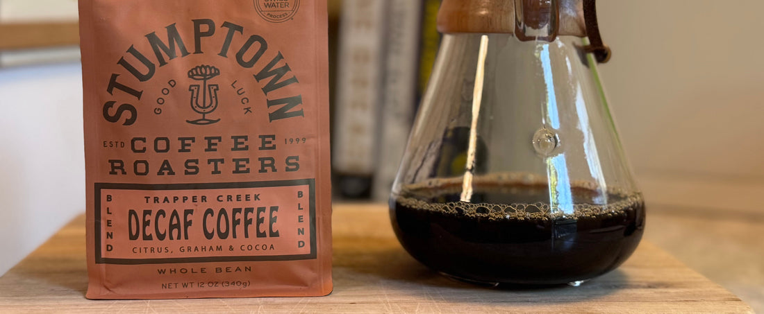 Bag of Stumptown Trapper Creek decaf next to a carafe of brewed coffee. Swiss Water roaster spotlight Stumptown Coffee Flat Track