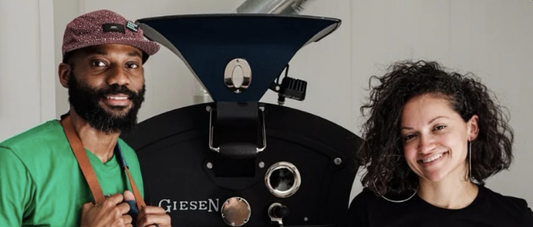 Tio and Kenzel Fallen of Three Keys Coffee standing with black Giesen roasterSwiss Water blog