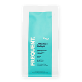 Frequent Coffee Jitterfree Delight Swiss Water Decaf whtie coffee bag with aqua label