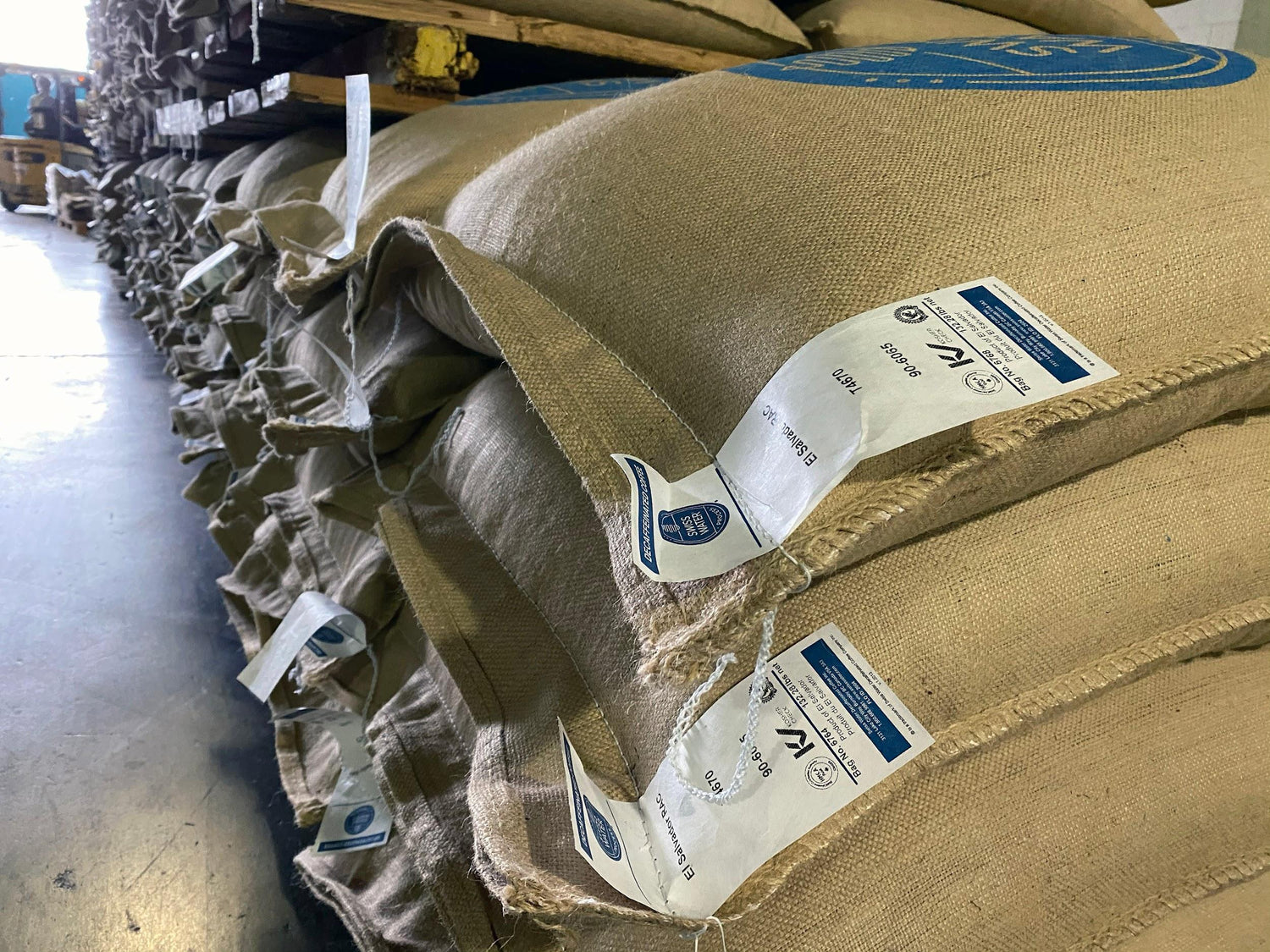 Green coffee sacks in warehouse